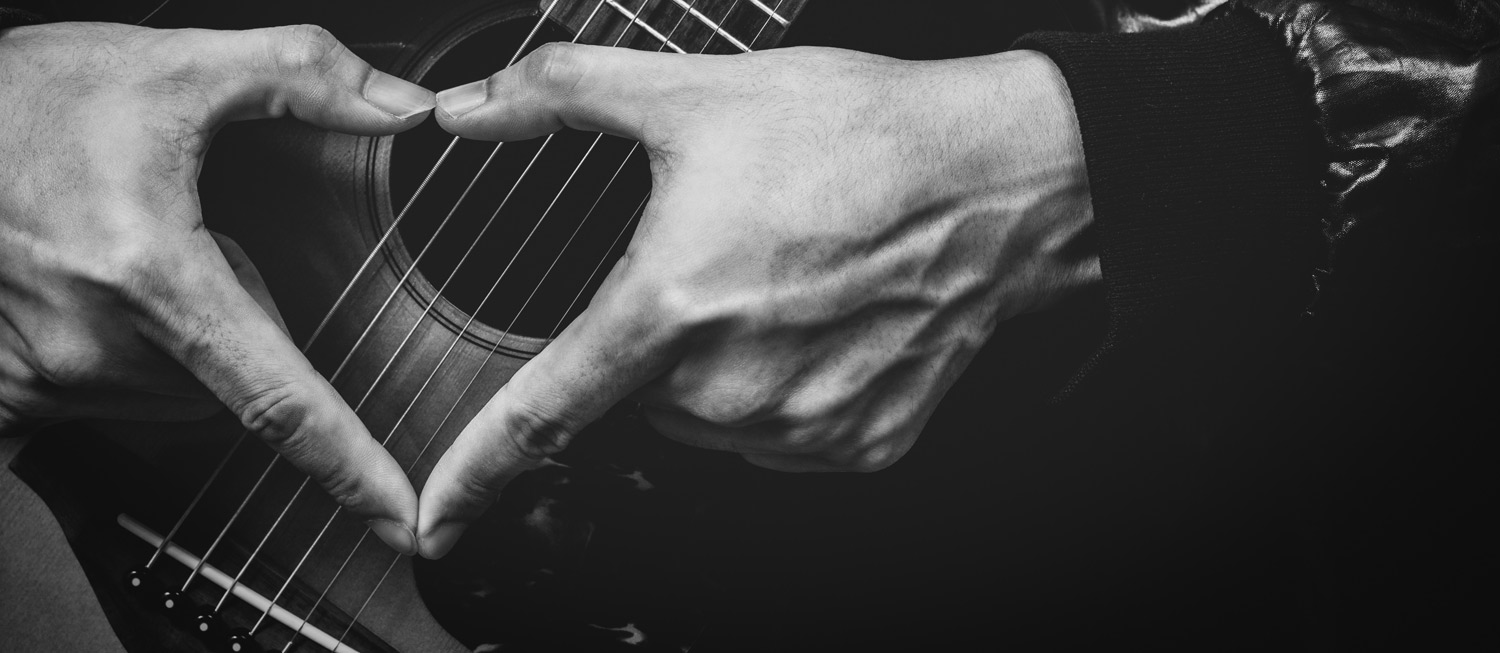 Guitar with fingers shaped like love heart